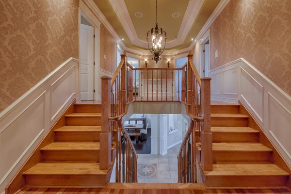 Double wooden staircases in luxury house